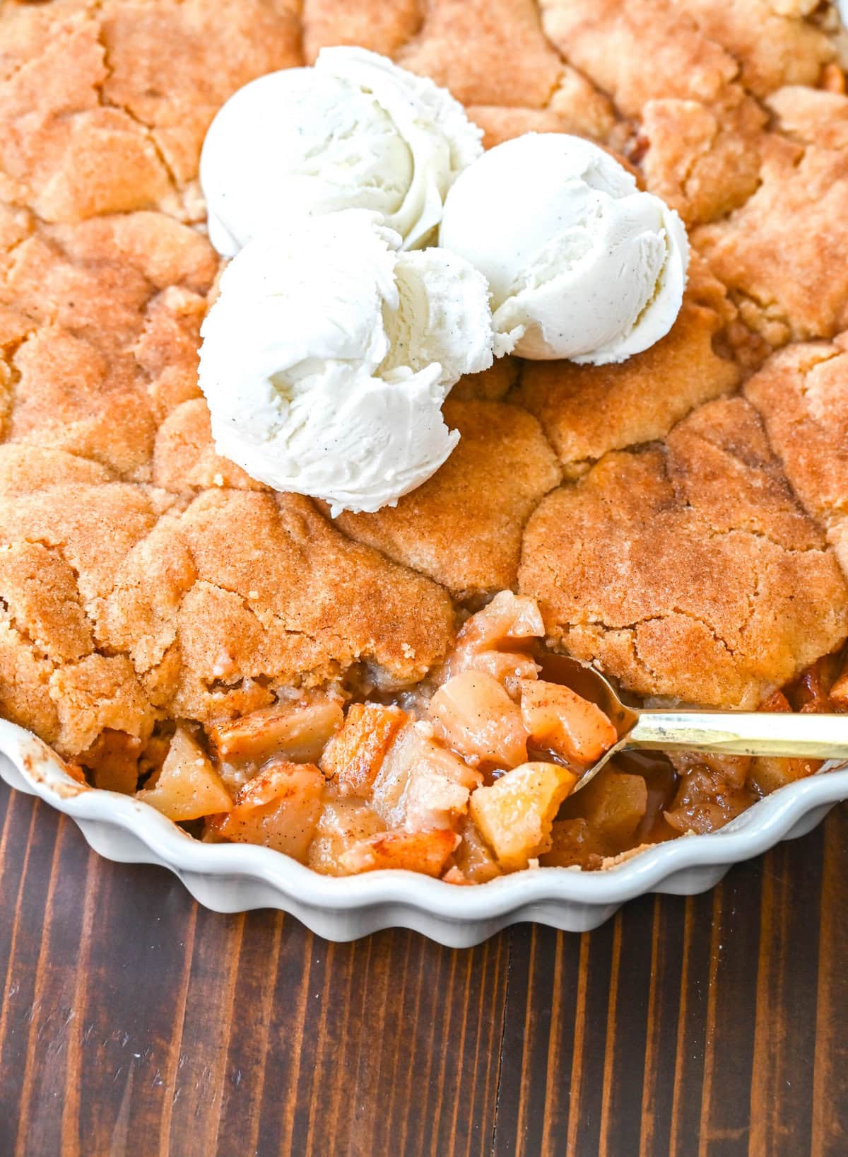 This Apple Cobbler recipe is made with fresh apples sauteed with butter, cinnamon, brown sugar, and apple cider and then baked with the most perfect topping that is sweet, crisp, and pairs perfectly with the fresh apples. This is the best apple cobbler recipe!