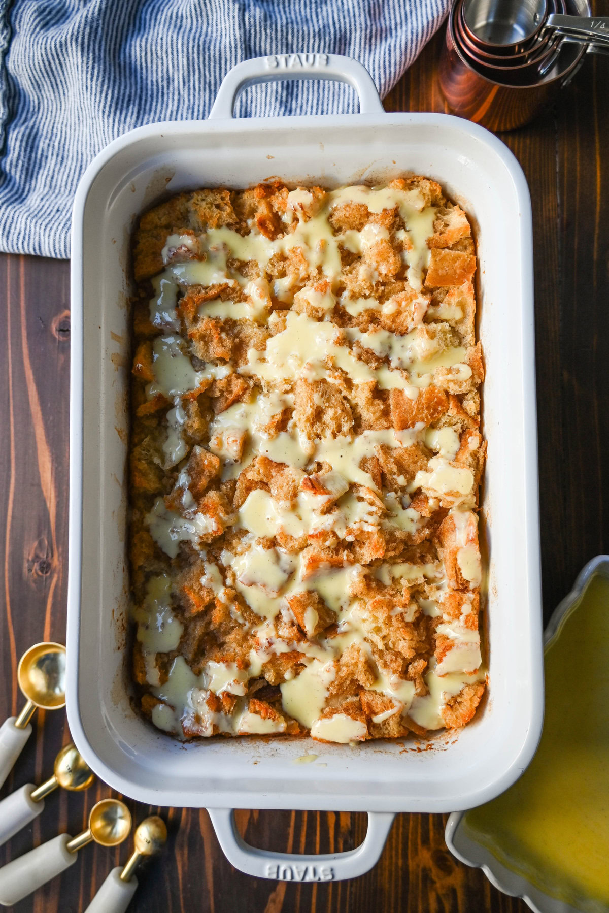 This is the best bread pudding recipe and is the ultimate comfort dessert, with a smooth vanilla bean custard that soaks into rich, day-old bread. Warm spices and vanilla enhance the creamy texture, while a crisp, golden crust forms on top. Finished with a homemade creme anglaise sauce and a dollop of fresh whipped cream. This Bread Pudding with Vanilla Sauce is the perfect comfort food dessert!