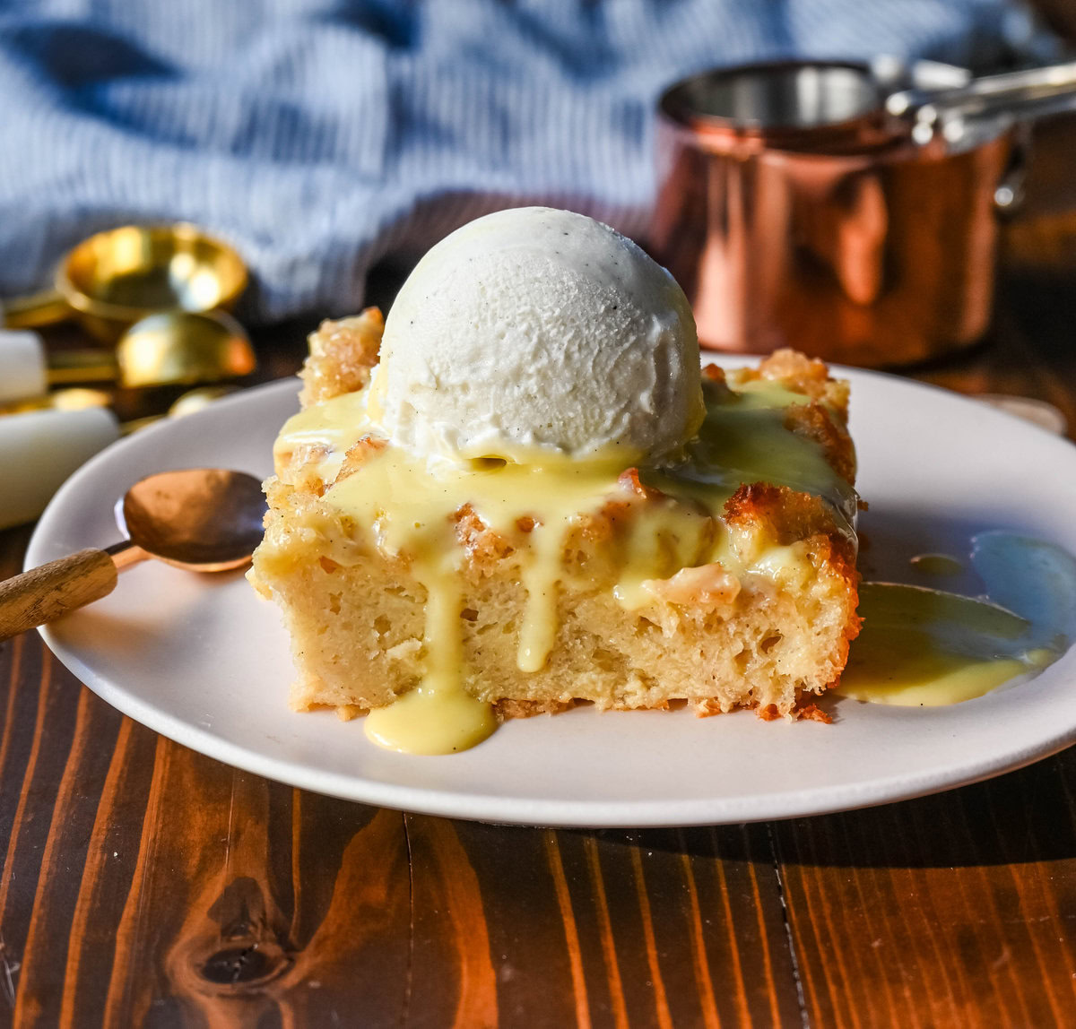 This is the best bread pudding recipe and is the ultimate comfort dessert, with a smooth vanilla bean custard that soaks into rich, day-old bread. Warm spices and vanilla enhance the creamy texture, while a crisp, golden crust forms on top. Finished with a homemade creme anglaise sauce and a dollop of fresh whipped cream. This Bread Pudding with Vanilla Sauce is the perfect comfort food dessert!