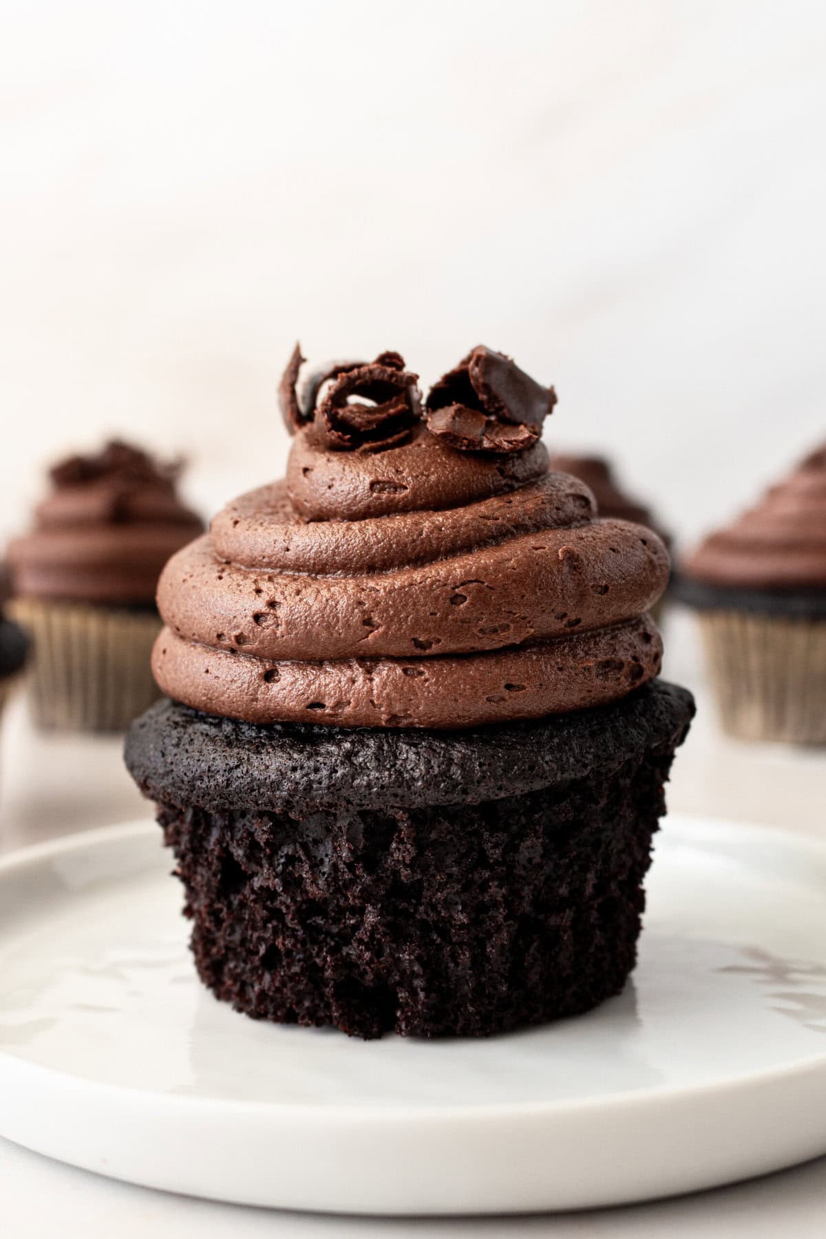 This is the Ultimate Chocolate Cupcake Recipe, with a rich, moist chocolate cake with a tender crumb and a velvet chocolate frosting. These are the best chocolate cupcakes you'll ever taste, with a deep cocoa flavor that melts in your mouth. Not only are they delicious, but this easy chocolate cupcake recipe takes just minutes to prepare. If you are looking for moist chocolate cupcakes that are 5-star rated, this is the recipe for you!