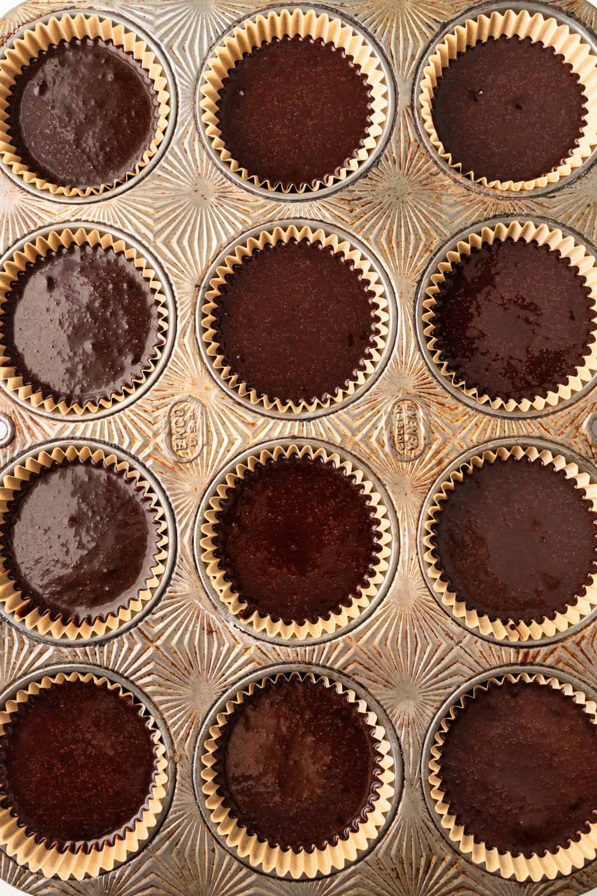 Chocolate cupcake cake batter in cupcake muffin tins