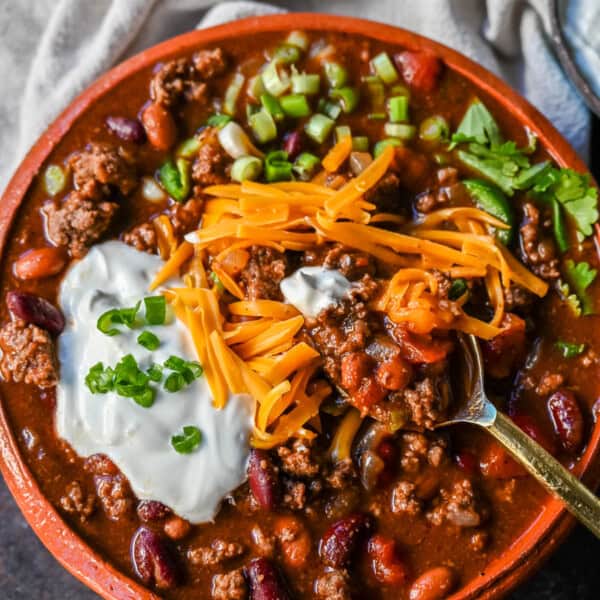 Crockpot Beef Chili. This slow cooker beef chili is the ultimate comforting meal, made even better with a surprising secret ingredient! This crockpot beef chili will be surefire hit and you'll be hooked on how the sweetness and spices come together to create the best crockpot chili.