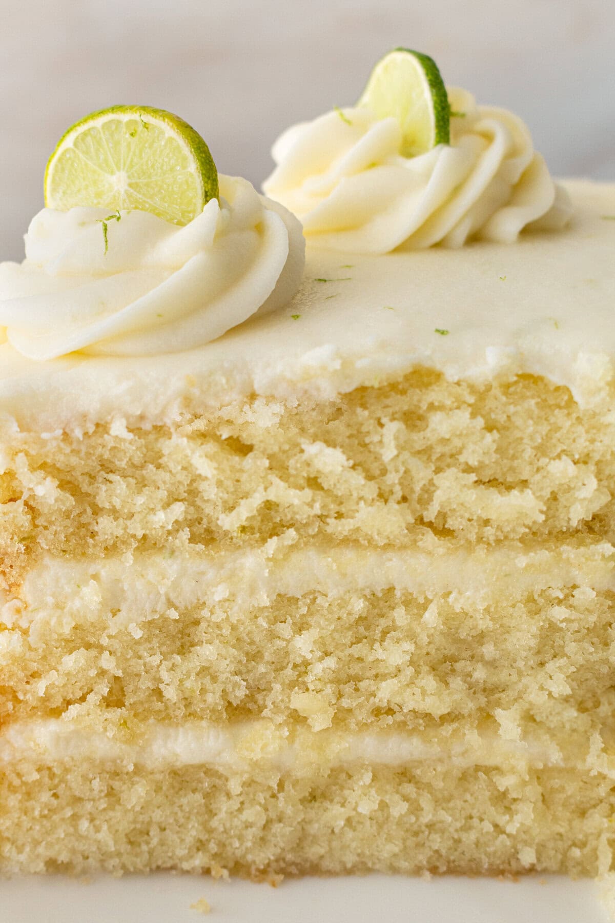 Moist key lime cake with sweet cream cheese frosting. A light and fluffy citrus lime cake with the perfect lime buttercream frosting! This is the best lime cake recipe!