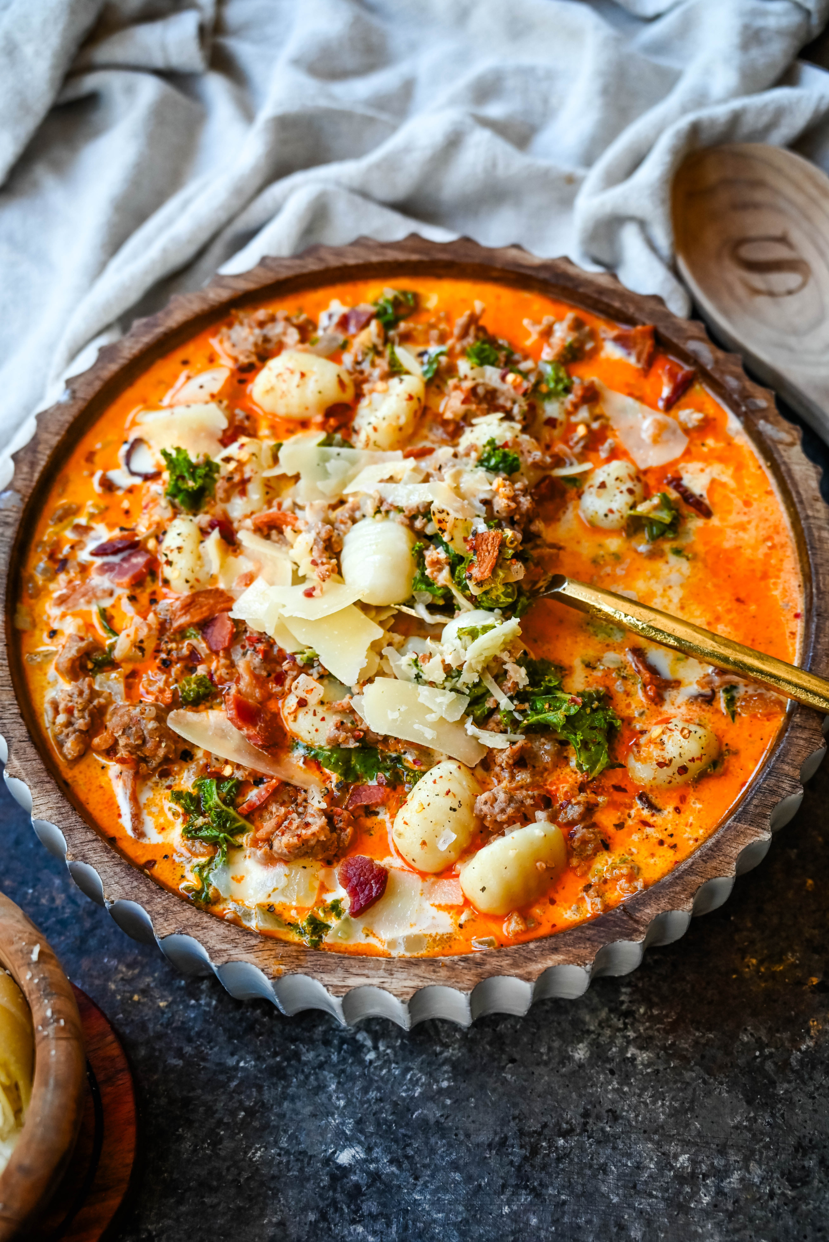 This Sausage Gnocchi Soup is everything you love about Olive Garden's famous Zuppa Toscana but with a twist! Instead of potatoes, we're using pillowy soft gnocchi that soak up all the rich, savory flavors of the creamy broth. Made with Italian sausage, tender gnocchi, fresh kale, and a dash of cream, this hearty soup is the perfect comfort food. It's super easy to make, comes together in about 30 minutes, and is guaranteed to become a family favorite!