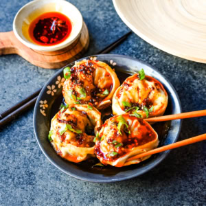 Spicy Wonton Dumplings with Spicy Chili Sauce. How to make the perfect spicy, sweet, and tangy homemade chili sauce to toss on wontons or dumplings for a quick and easy meal. This recipe is reminiscent of the spicy wontons you will find at Din Tai Fung.