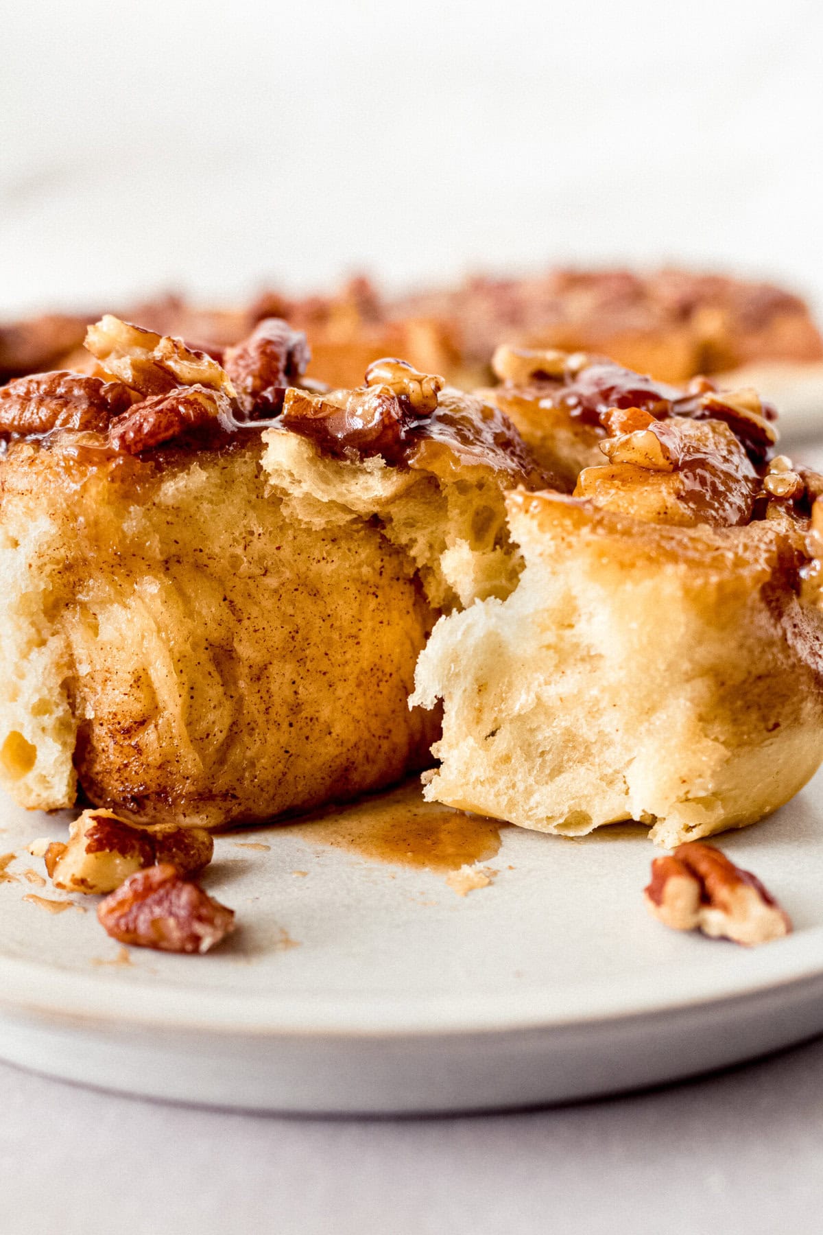 Caramel pecan sticky buns also known as caramel pecan rolls are homemade sweet rolls filled with a brown sugar cinnamon filling and topped with a rich caramel sauce and pecans. Sweet, nutty, and rich, this is the best sticky bun recipe!