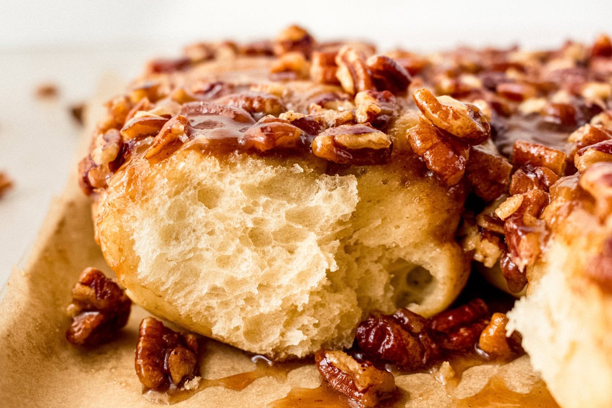 Caramel pecan sticky buns also known as caramel pecan rolls are homemade sweet rolls filled with a brown sugar cinnamon filling and topped with a rich caramel sauce and pecans. Sweet, nutty, and rich, this is the best sticky bun recipe!