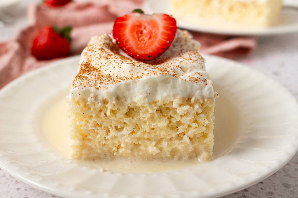 Tres Leches Cake. A classic Mexican dessert made with a vanilla sponge cake soaked with three kinds of milk -- heavy cream, evaporated milk and sweetened condensed milk and topped with fresh sweetened whipped cream. An authentic Mexican dessert recipe!