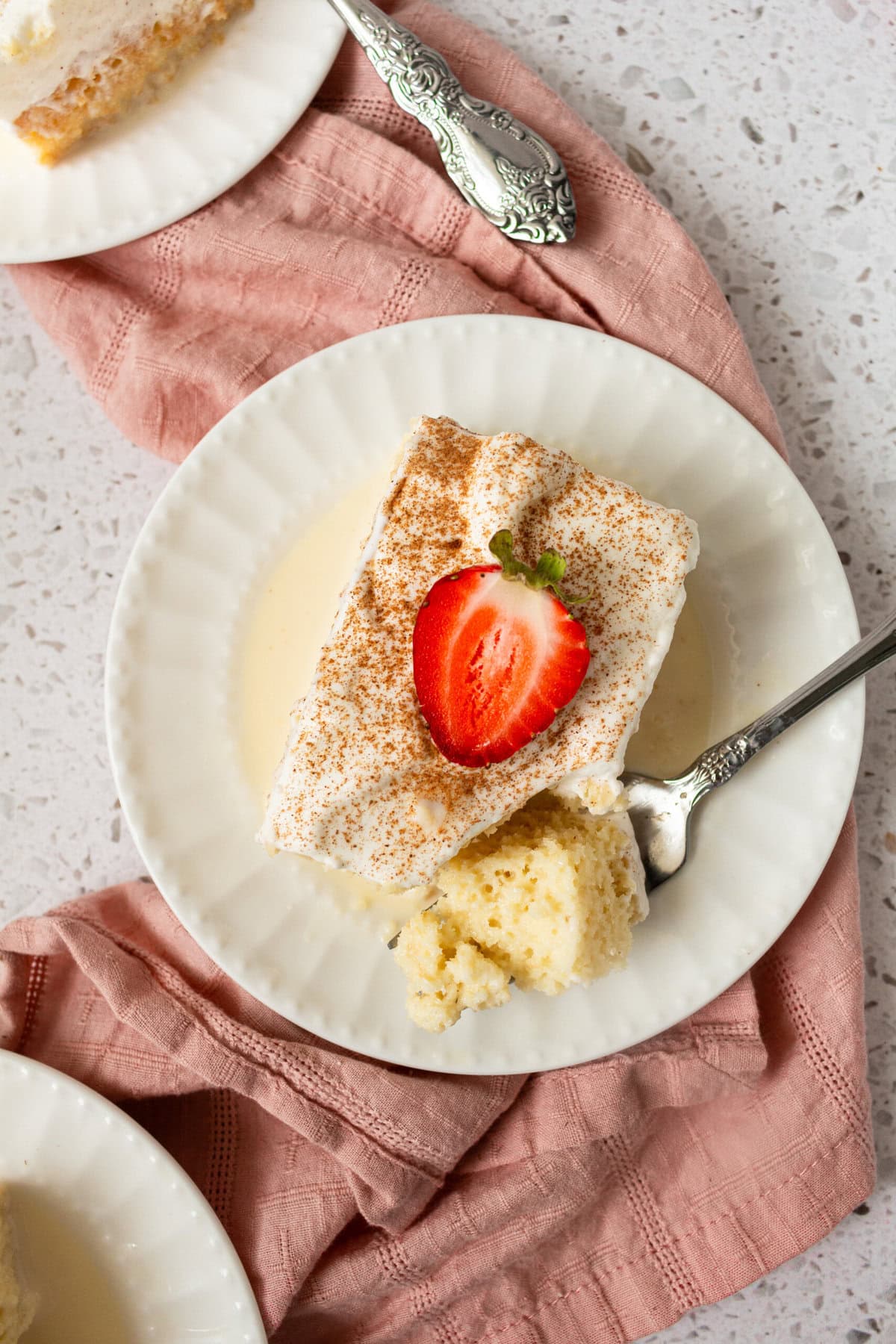 Tres Leches Cake. A classic Mexican dessert made with a vanilla sponge cake soaked with three kinds of milk -- heavy cream, evaporated milk and sweetened condensed milk and topped with fresh sweetened whipped cream. An authentic Mexican dessert recipe!