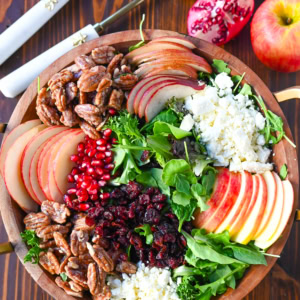 If you're looking for a beautiful, seasonal salad perfect for autumn, Fall, and Thanksgiving gatherings, this Honeycrisp Apple and Candied Pecan Salad is sure to impress! It has a combination of crisp fruits, creamy goat cheese, sweet and crunchy candied pecans, and a tangy homemade maple dressing.