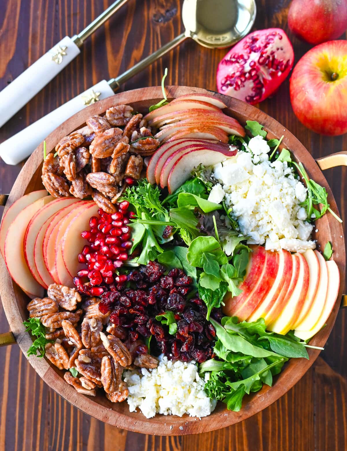 If you're looking for a beautiful, seasonal salad perfect for autumn, Fall, and Thanksgiving gatherings, this Honeycrisp Apple and Candied Pecan Salad is sure to impress! It has a combination of crisp fruits, creamy goat cheese, sweet and crunchy candied pecans, and a tangy homemade maple dressing.