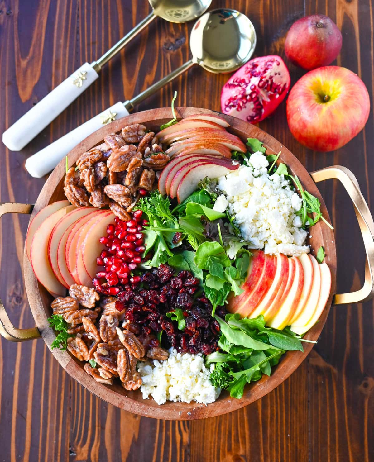 If you're looking for a beautiful, seasonal salad perfect for autumn, Fall, and Thanksgiving gatherings, this Honeycrisp Apple and Candied Pecan Salad is sure to impress! With a combination of crisp fruits, creamy goat cheese, sweet and crunchy candied pecans, and a tangy homemade maple dressing, this salad highlights the season.