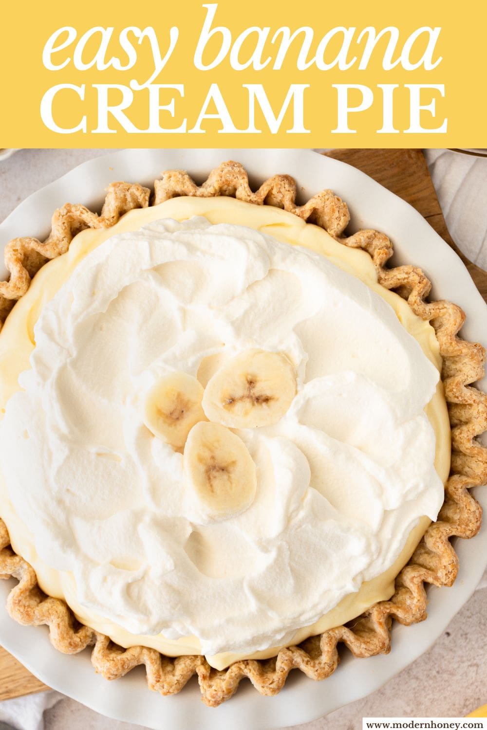 Indulge in the sweet and creamy goodness of this classic dessert. This Banana Cream Pie Recipe is made with a buttery crust, smooth vanilla custard, fresh bananas, and topped with fluffy whipped cream. This easy banana cream pie is sure to satisfy any sweet tooth.