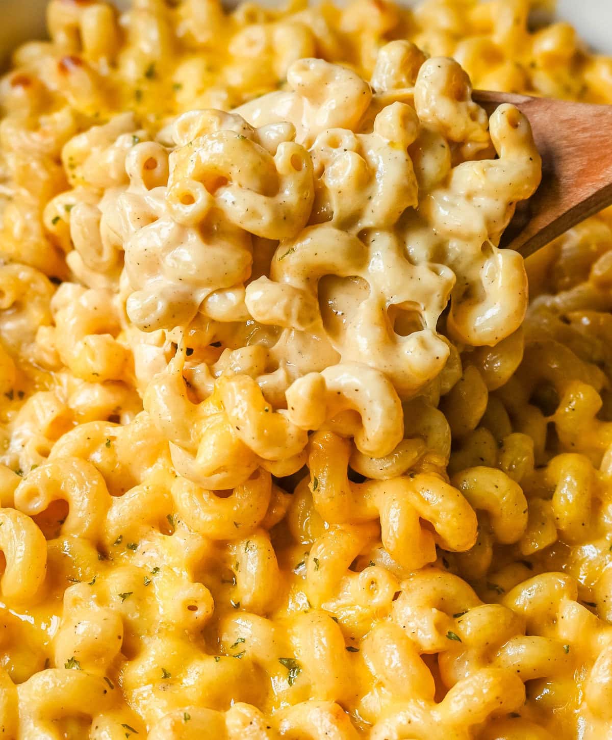 How to make a quick, easy, creamy, cheesy homemade mac and cheese recipe. All of the tips and tricks for making a velvety cheese sauce that is completely smooth. You will love this easy mac and cheese recipe!