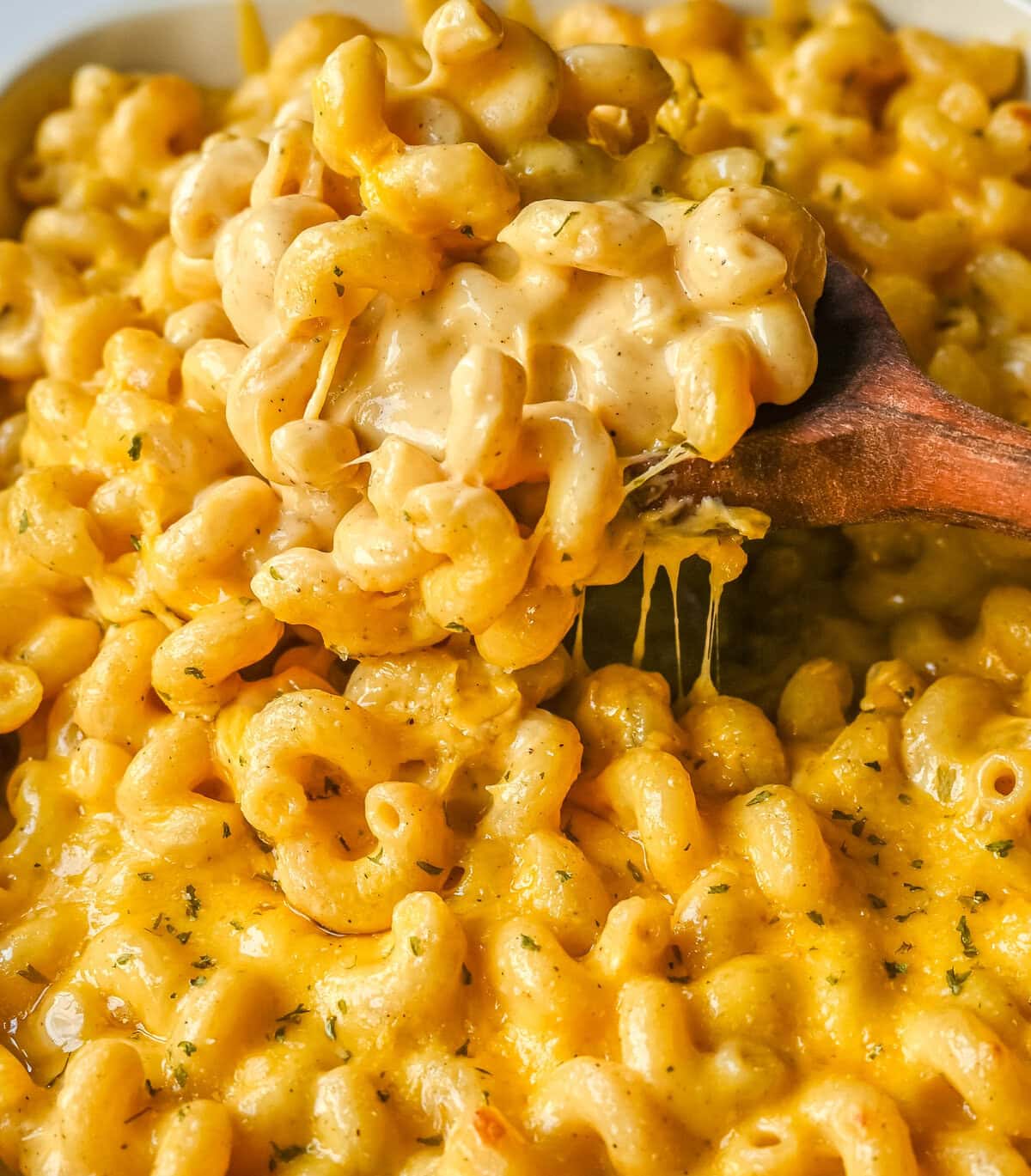 How to make a quick, easy, creamy, cheesy homemade mac and cheese recipe. All of the tips and tricks for making a velvety cheese sauce that is completely smooth. You will love this easy mac and cheese recipe!