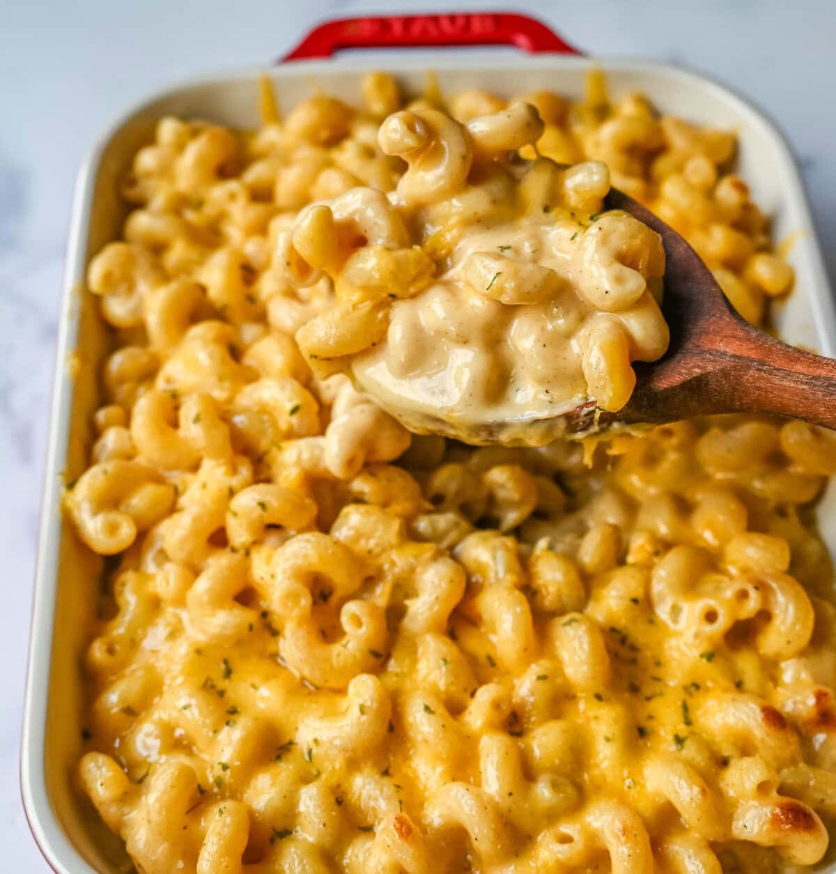 A spoonful of easy homemade mac and cheese. How to make a quick, easy, creamy, cheesy homemade mac and cheese recipe. All of the tips and tricks for making a velvety cheese sauce that is completely smooth. You will love this easy mac and cheese recipe!