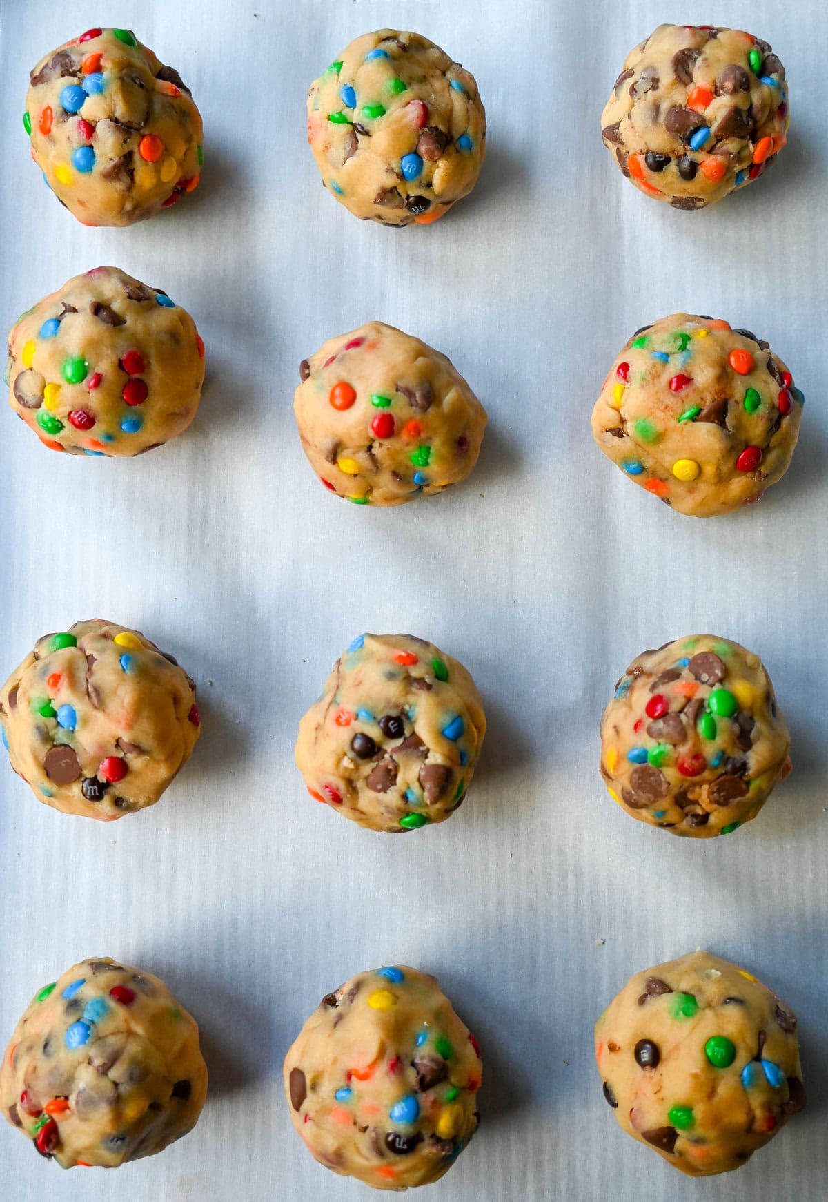 M&M Nutella Lava Cookie dough balls on cookie sheet. 