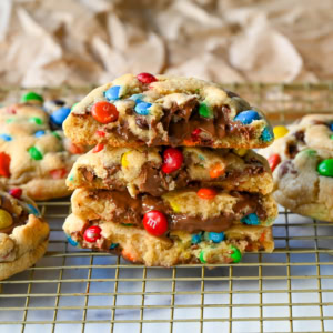 M&M Nutella Lava Cookies. These M&M Nutella Stuffed Cookies are made with milk chocolate chip and M&M cookies filled with creamy chocolate hazelnut Nutella spread and baked until perfectly soft and chewy.