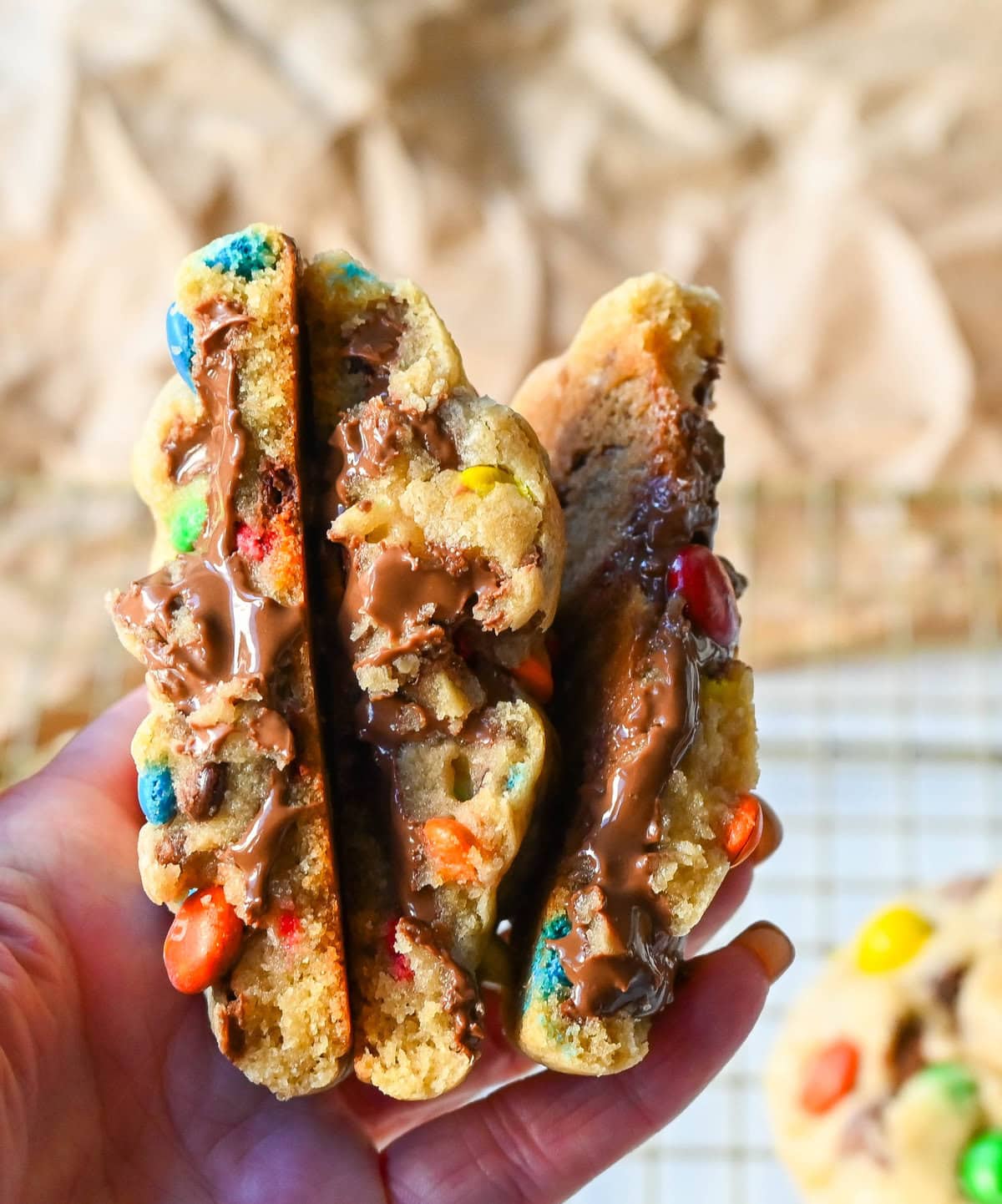 These M&M Nutella Stuffed Cookies are made with milk chocolate chip and M&M cookies filled with creamy chocolate hazelnut Nutella spread and baked until perfectly soft and chewy.