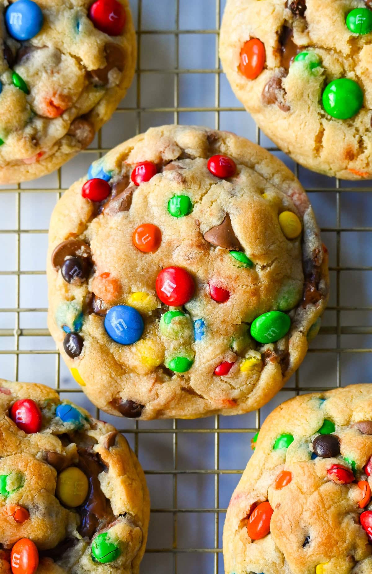 These M&M Nutella Stuffed Cookies are made with milk chocolate chip and M&M cookies filled with creamy chocolate hazelnut Nutella spread and baked until perfectly soft and chewy.