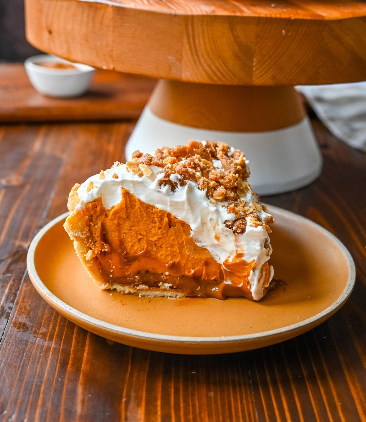 Milk Bar Hilly's Pumpkin Caramel Pie Recipe. How to make the famous, viral NYC's Milk Bar Pumpkin Caramel Pie. This pie starts with a homemade pie crust, filled with a spiced pumpkin white chocolate ganache, salted caramel, fresh sweetened whipped cream, and a homemade streusel topping. You will love this Pumpkin Caramel Pie Recipe!