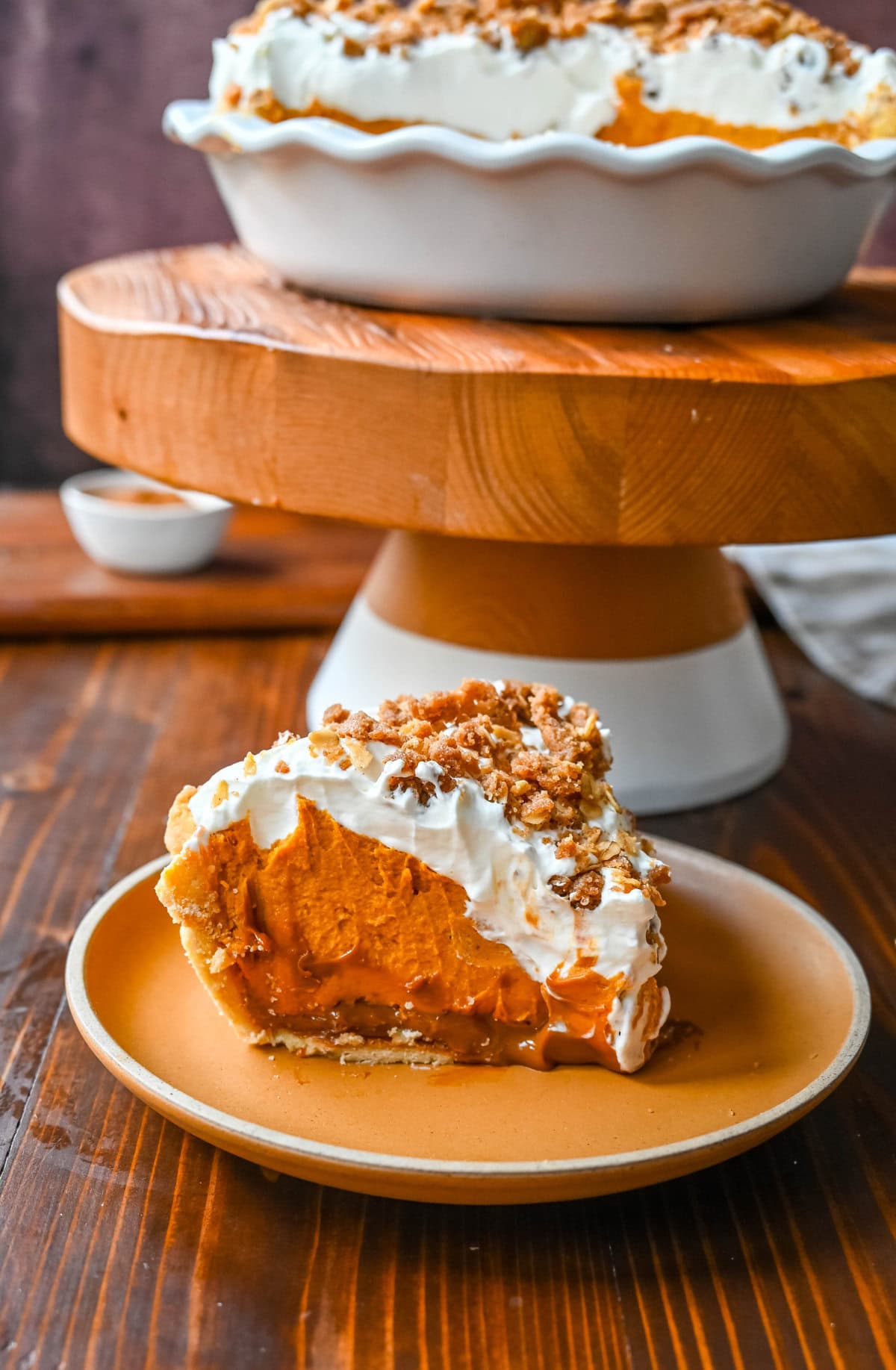 Milk Bar Hilly's Pumpkin Caramel Pie Recipe. How to make the famous, viral NYC's Milk Bar Pumpkin Caramel Pie. This pie starts with a homemade pie crust, filled with a spiced pumpkin white chocolate ganache, salted caramel, fresh sweetened whipped cream, and a homemade streusel topping. You will love this Pumpkin Caramel Pie Recipe!