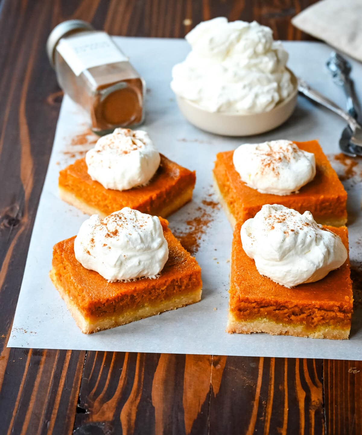 These homemade Pumpkin Pie Bars are made with a buttery shortbread crust and topped with a creamy pumpkin cream cheese filling and baked. These easy pumpkin pie bars are topped with fresh whipped cream and cut into squares for an easy alternative to pumpkin pie.