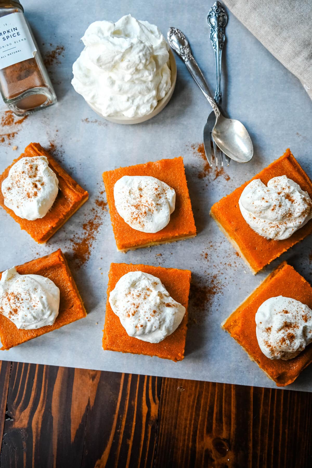 These homemade Pumpkin Pie Bars are made with a buttery shortbread crust and topped with a creamy pumpkin cream cheese filling and baked. These easy pumpkin pie bars are topped with fresh whipped cream and cut into squares for an easy alternative to pumpkin pie.