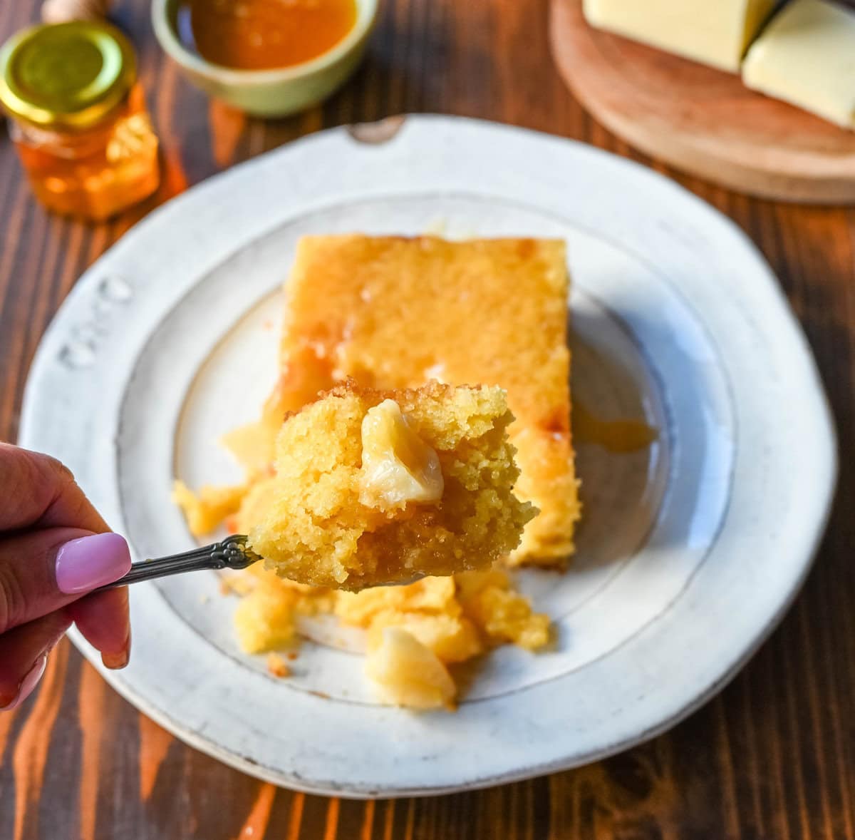 A bite of cornbread with honey butter