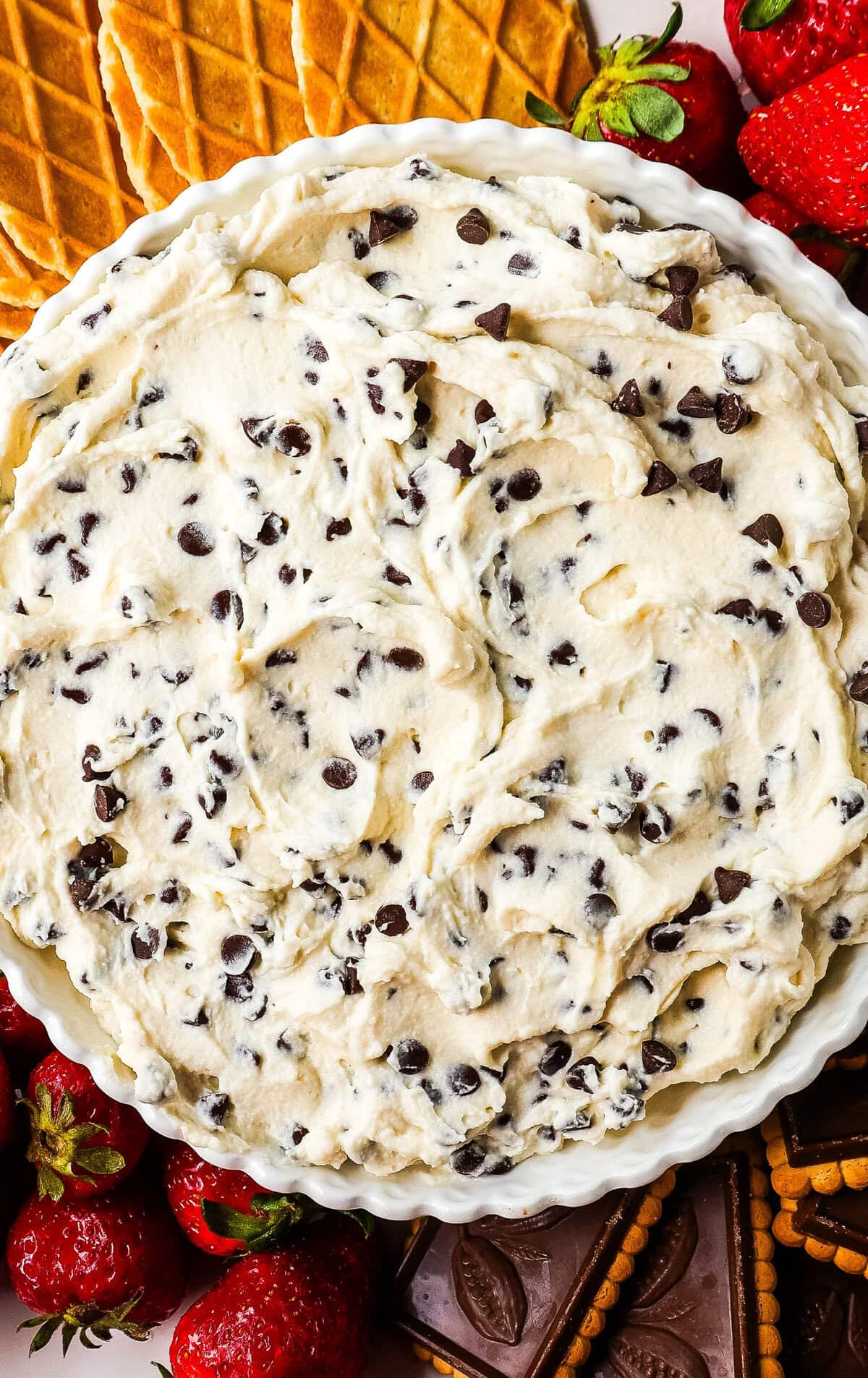 How to make homemade cannoli dip with ricotta cheese, mascarpone or cream cheese, powdered sugar, brown sugar, vanilla, and mini chocolate chips. The taste of the Trader Joe's cannoli dip but so much better!