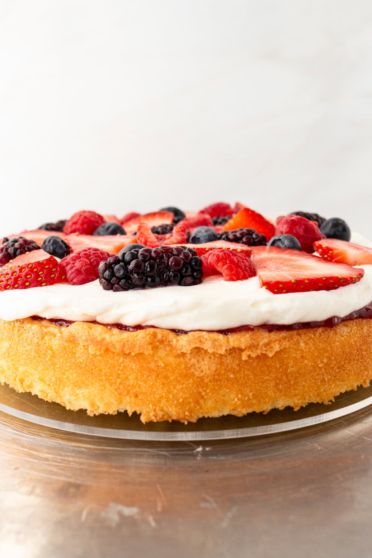 Chantilly Cake Recipe. Homemade moist yellow cake layered with fluffy sweet cream cheese whipped cream frosting and fresh berries. This Chantilly Cake is famous at Whole Foods and here's my copycat version so you can make it at home. This is the best Chantilly Cake recipe!