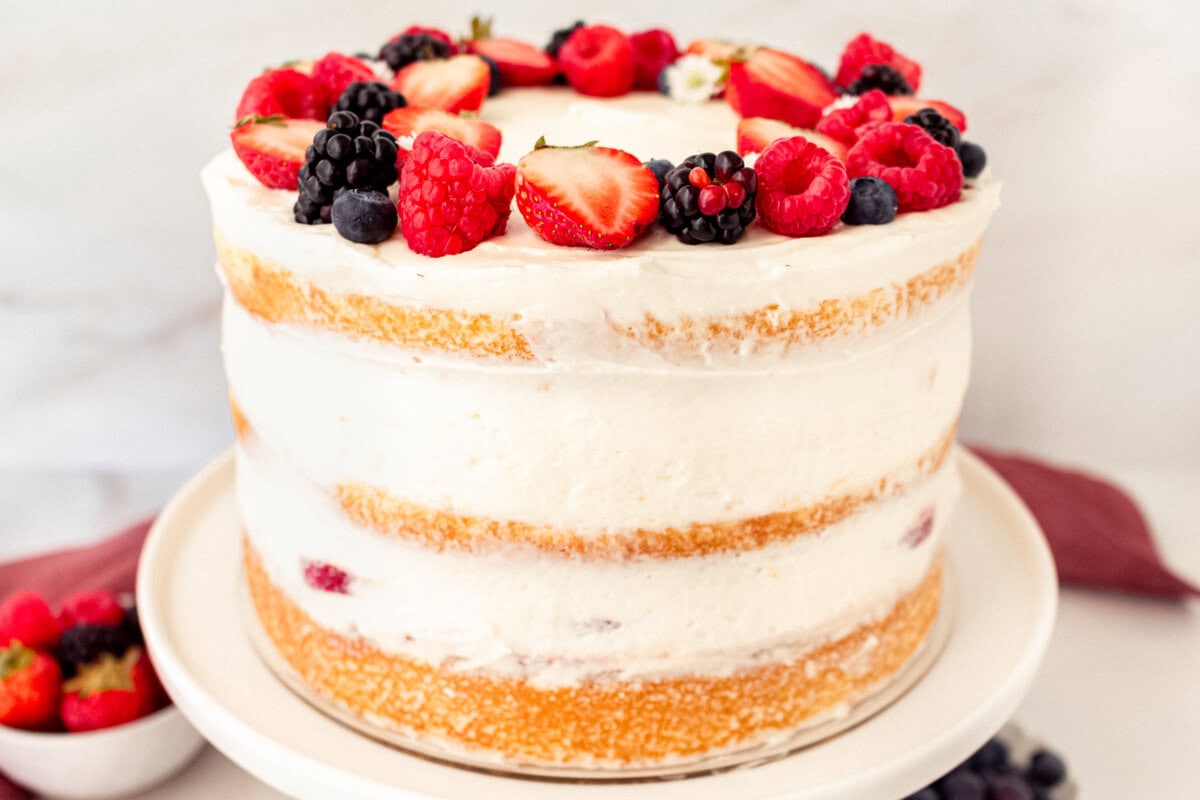 Chantilly Cake Recipe. Homemade moist yellow cake layered with fluffy sweet cream cheese whipped cream frosting and fresh berries. This Chantilly Cake is famous at Whole Foods and here's my copycat version so you can make it at home. This is the best Chantilly Cake recipe!