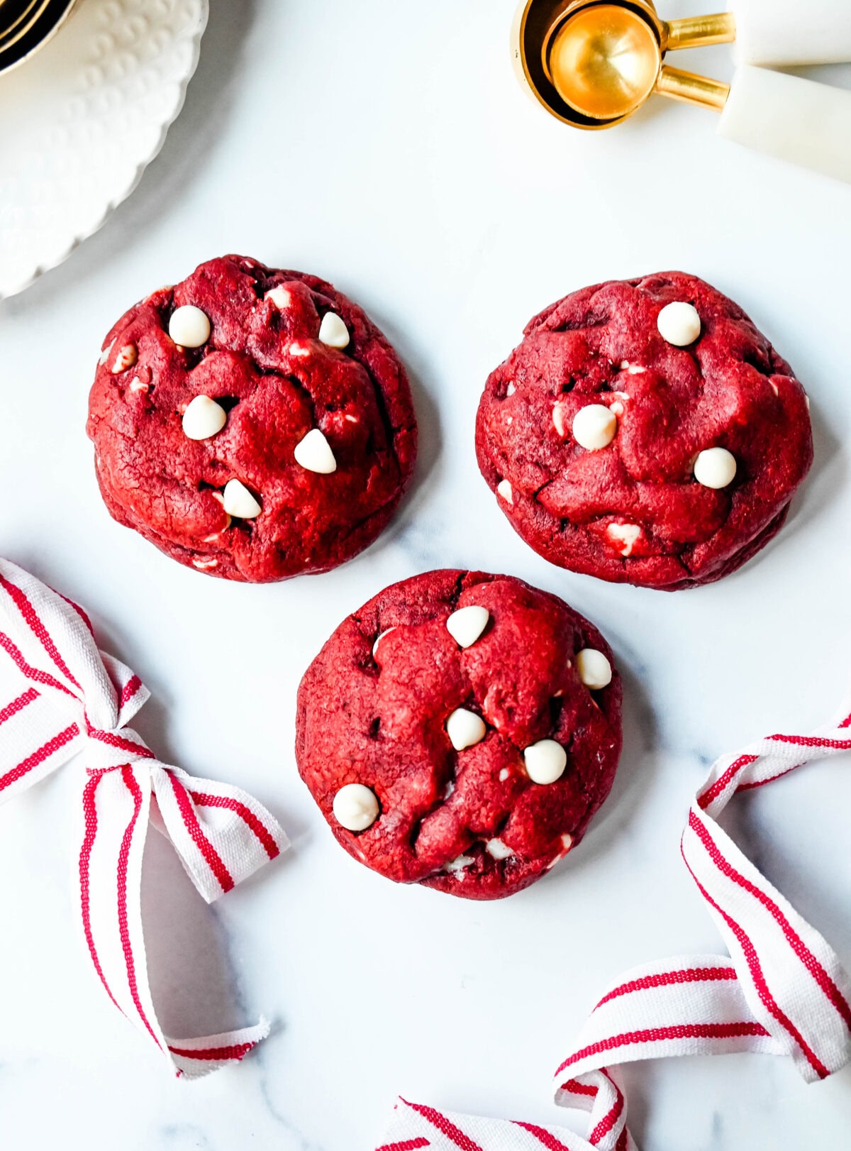 Cheesecake stuffed Red Velvet Cookies with white chocolate chips and a creamy cheesecake center are the perfect Christmas cookie. A vibrant red velvet cookie meets a creamy cheesecake center, with bursts of sweetness from white chocolate chips in every bite.