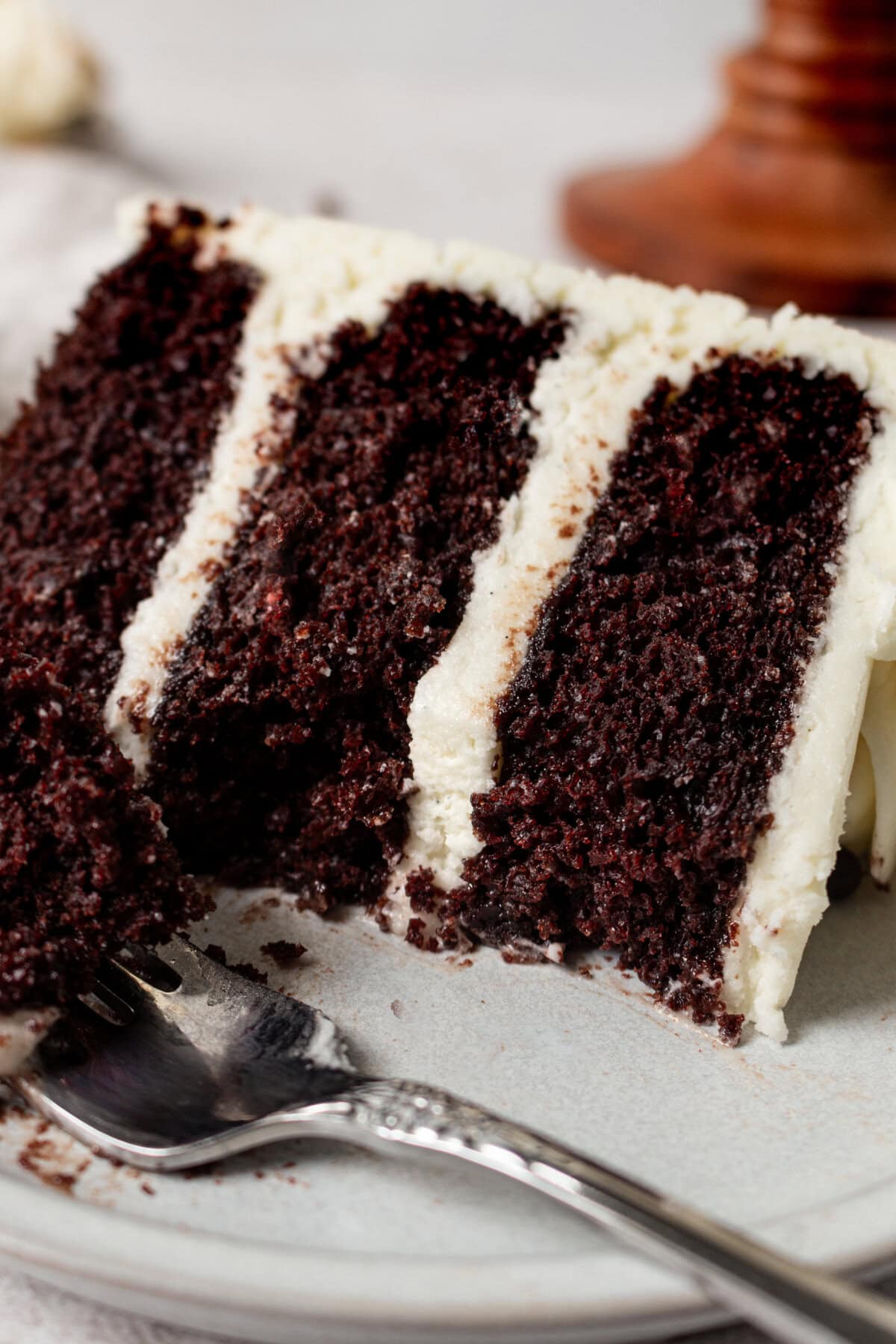 Rich, moist homemade chocolate cake with a creamy vanilla frosting. This decadent chocolate cake with vanilla frosting is a moist, rich chocolate cake covered in a smooth, sweet vanilla buttercream. Sometimes known as a chocolate layer cake with white icing or a chocolate birthday cake with vanilla buttercream, it’s perfect for any celebration. The perfect Black and White Cake!