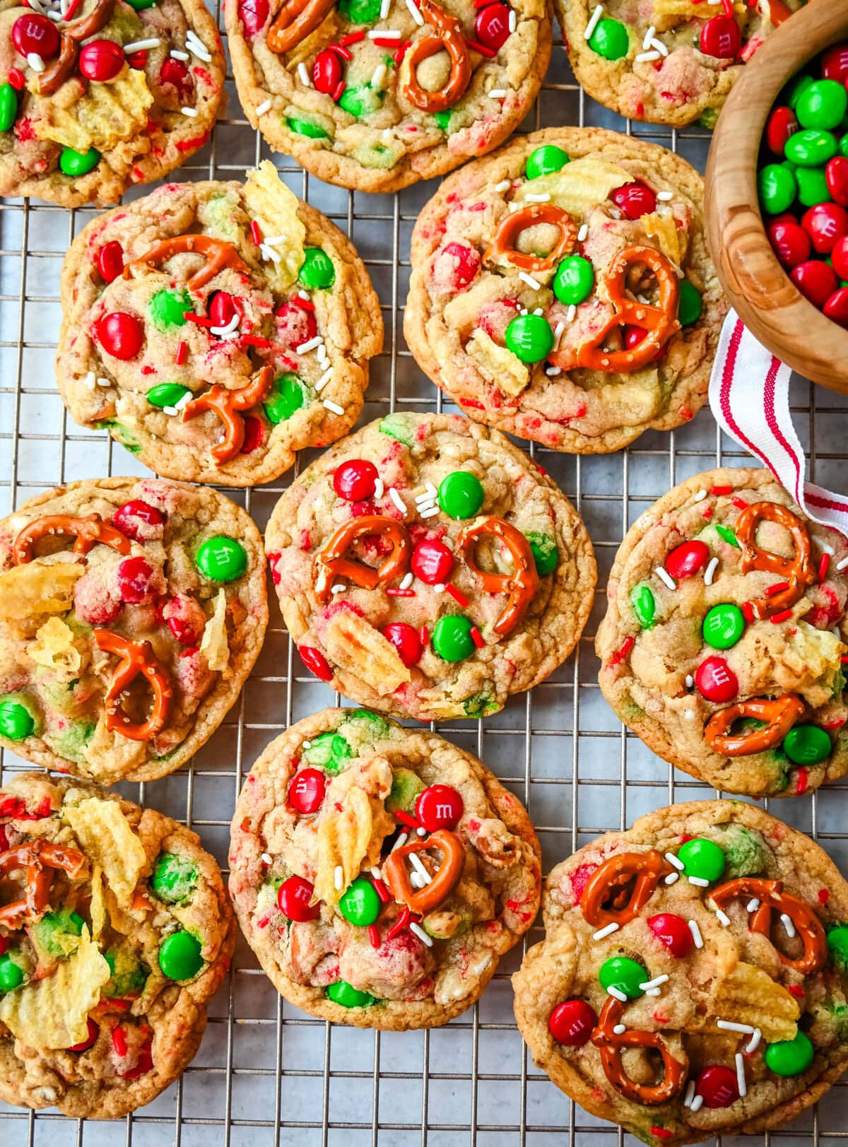 Get ready to bake the ultimate Christmas treat with these Christmas Kitchen Sink Cookies! Packed with holiday M&M's, pretzels, potato chips, sprinkles, and optional chocolate chips, these cookies bring together sweet, salty, and festive flavors in every bite. They're easy to make, fun to customize, and perfect for gifting, cookie swaps, and for your Christmas baking.