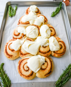 Frost the Cinnamon Roll Christmas Tree with frosting.