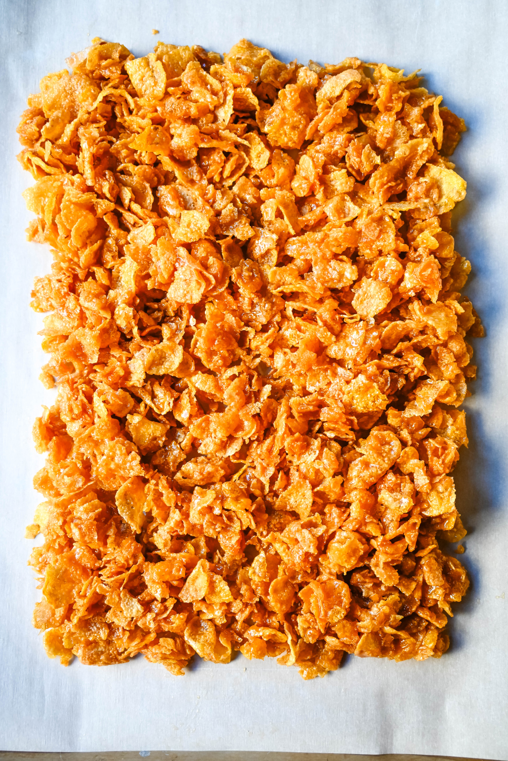 Cornflake Crack is a super easy treat made with only three ingredients -- cornflakes cereal, butter, and brown sugar—this quick treat bakes into a caramelized layer of goodness that’s perfect on its own or even better when dipped in melted chocolate. This can also be called Cornflake Crunch or Cornflake Candy.