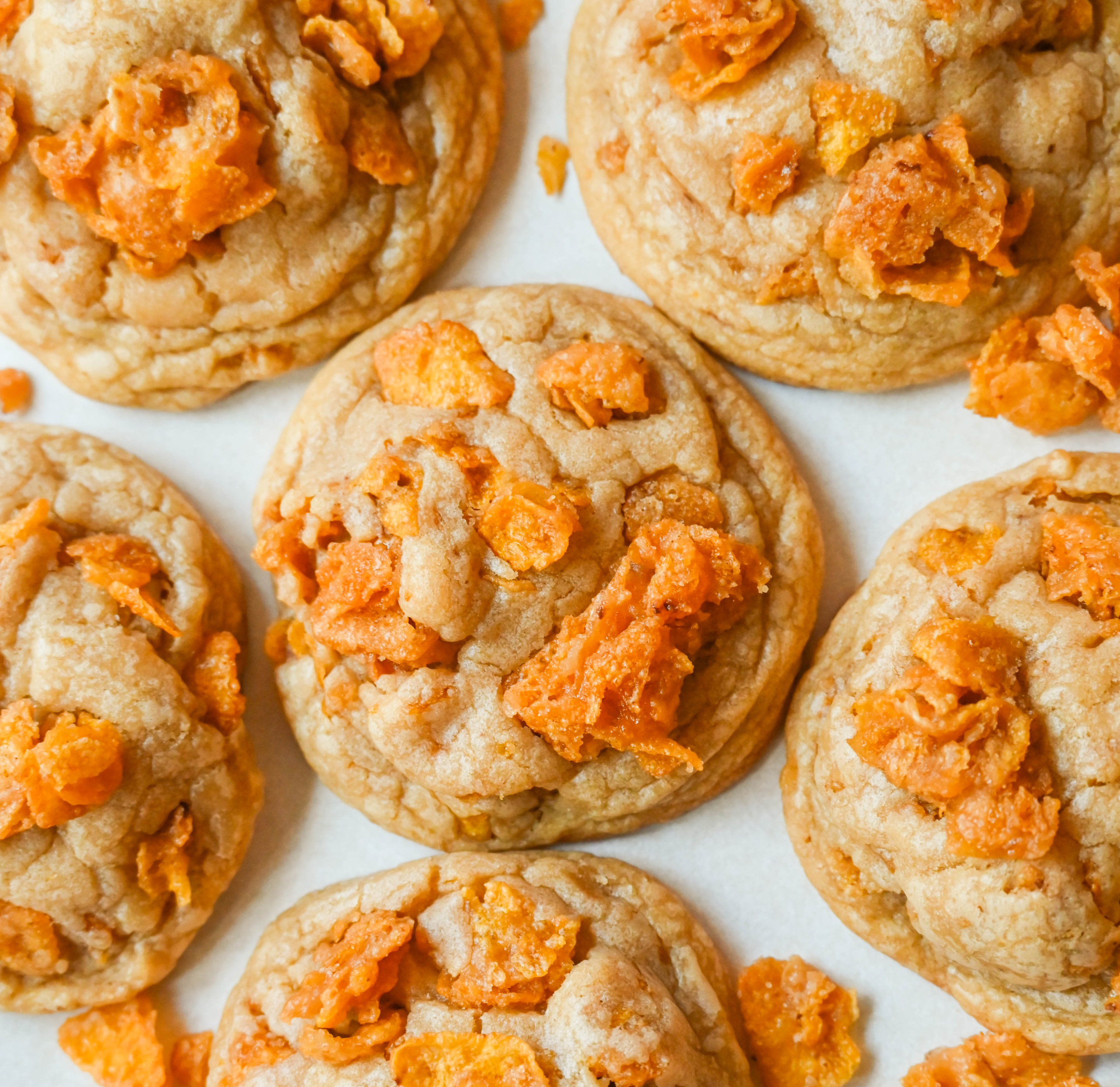 These Cornflake Crack Cookies are buttery, chewy, crispy cookies with toffee caramel notes thanks to homemade cornflake crack in and on top of the cookies. These sweet and salty cookies are always a hit!