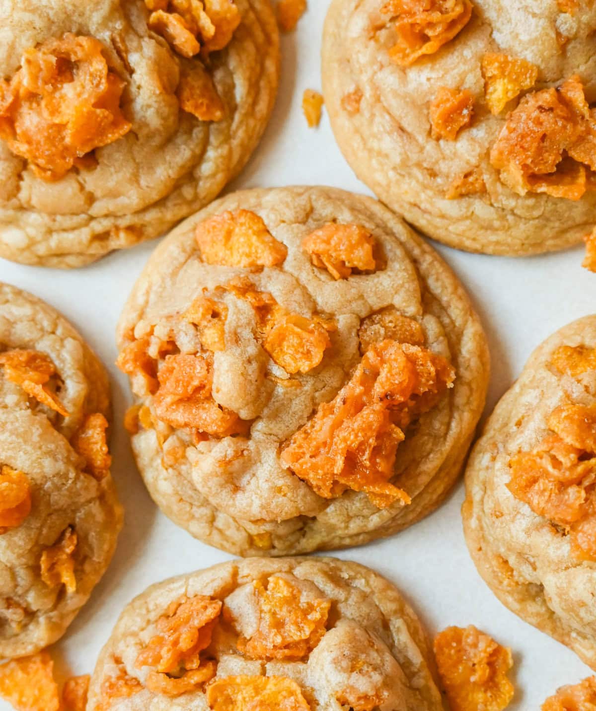 These Cornflake Crack Cookies are buttery, chewy, crispy cookies with toffee caramel notes thanks to homemade cornflake crack in and on top of the cookies. These sweet and salty cookies are always a hit!