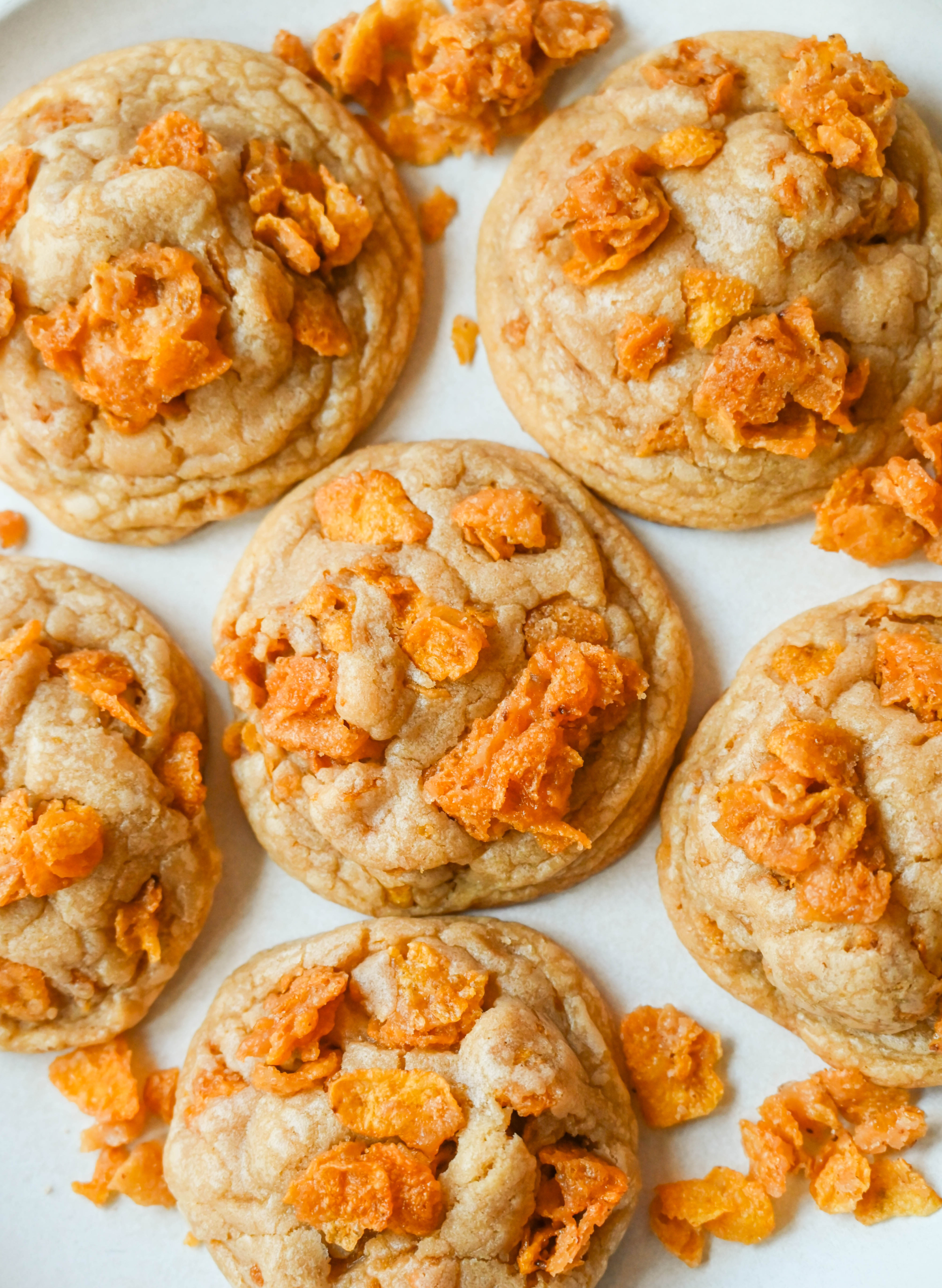 These Cornflake Crack Cookies are buttery, chewy, crispy cookies with toffee caramel notes thanks to homemade cornflake crack in and on top of the cookies. These sweet and salty cookies are always a hit!