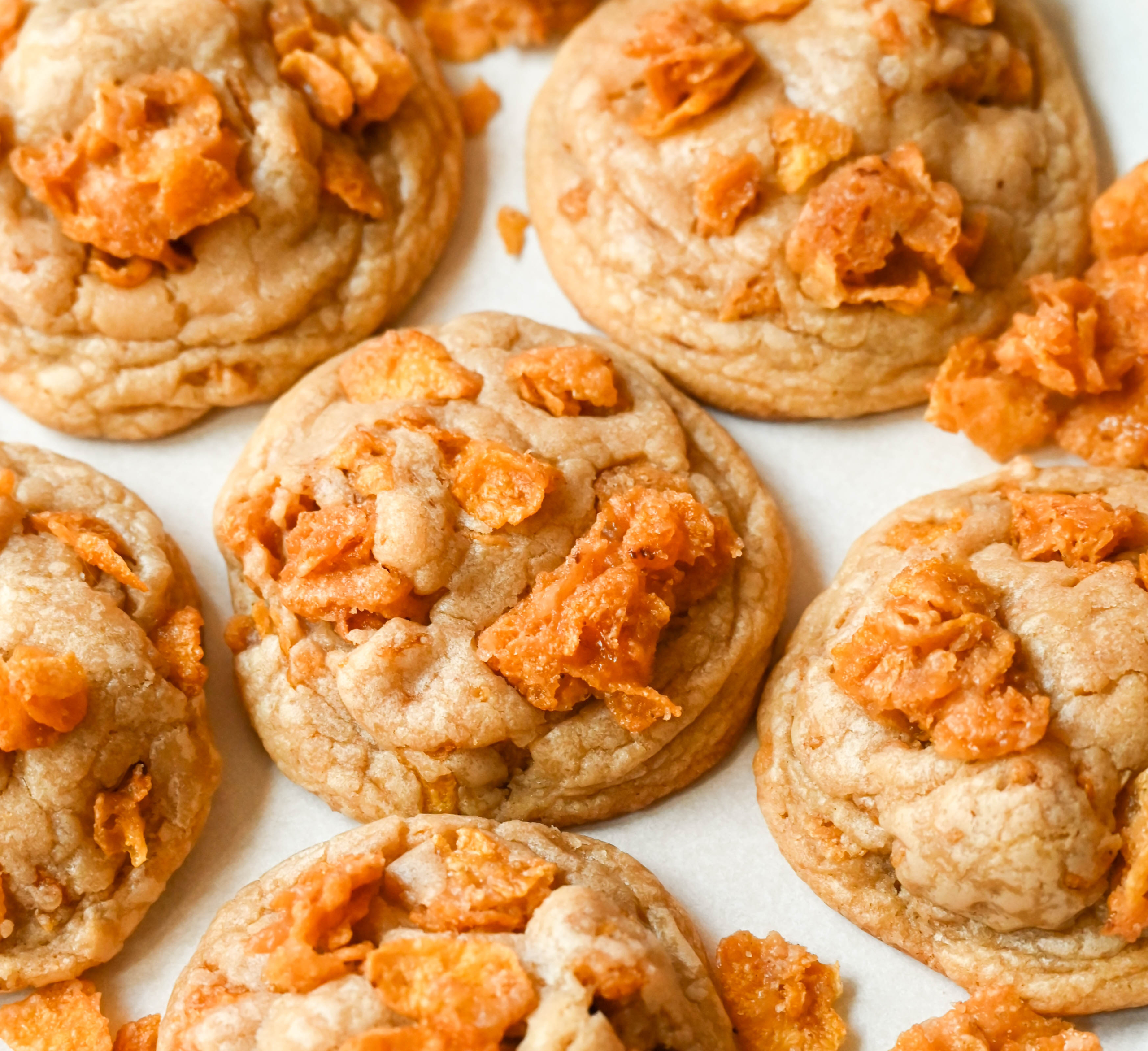 These Cornflake Crack Cookies are buttery, chewy, crispy cookies with toffee caramel notes thanks to homemade cornflake crack in and on top of the cookies. These sweet and salty cookies are always a hit!