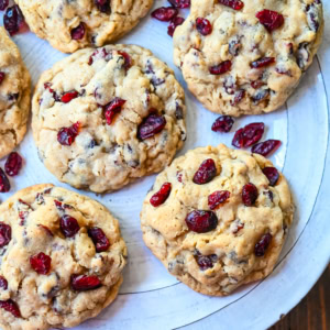 Soft chewy brown sugar oatmeal cookies with sweetened dried cranberries. A chewy and hearty oatmeal cookie that everyone will love! These Cranberry Oatmeal Cookies always receive 5-star reviews. You will love these Oatmeal Cranberry Cookies!