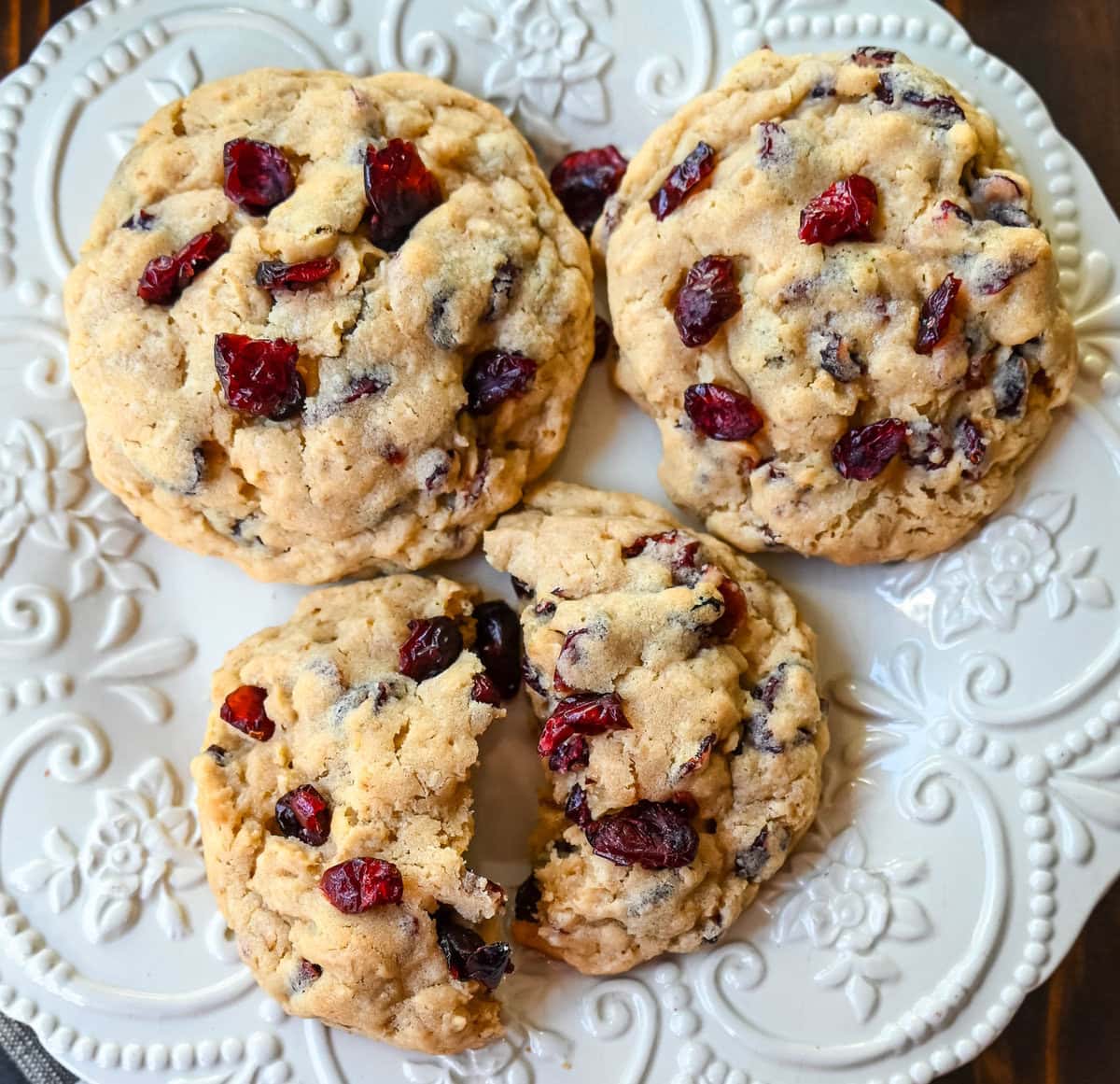 Soft chewy brown sugar oatmeal cookies with sweetened dried cranberries. A chewy and hearty oatmeal cookie that everyone will love! These Cranberry Oatmeal Cookies always receive 5-star reviews. You will love these Oatmeal Cranberry Cookies!