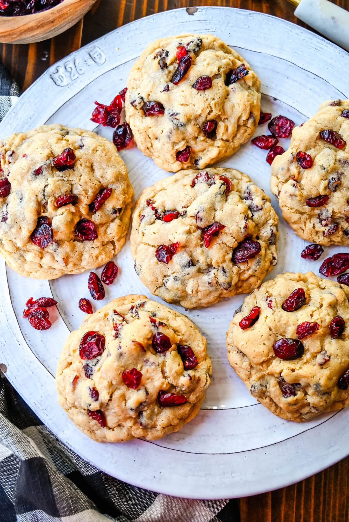 Soft chewy brown sugar oatmeal cookies with sweetened dried cranberries. A chewy and hearty oatmeal cookie that everyone will love! These Cranberry Oatmeal Cookies always receive 5-star reviews. You will love these Oatmeal Cranberry Cookies!