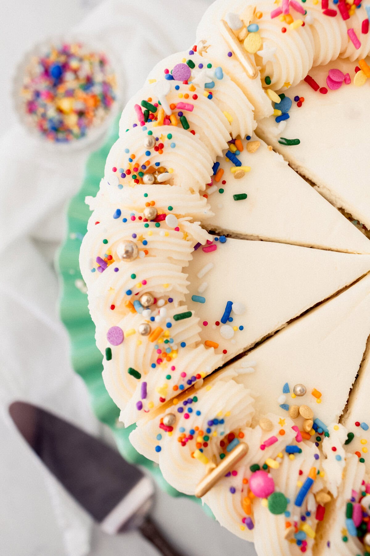 A layered funfetti or confetti cake with sprinkles. A fluffy homemade Funfetti birthday cake with rainbow sprinkles topped with a light cream cheese buttercream frosting and an array of sprinkles. This Confetti Cake recipe is the perfect birthday cake!