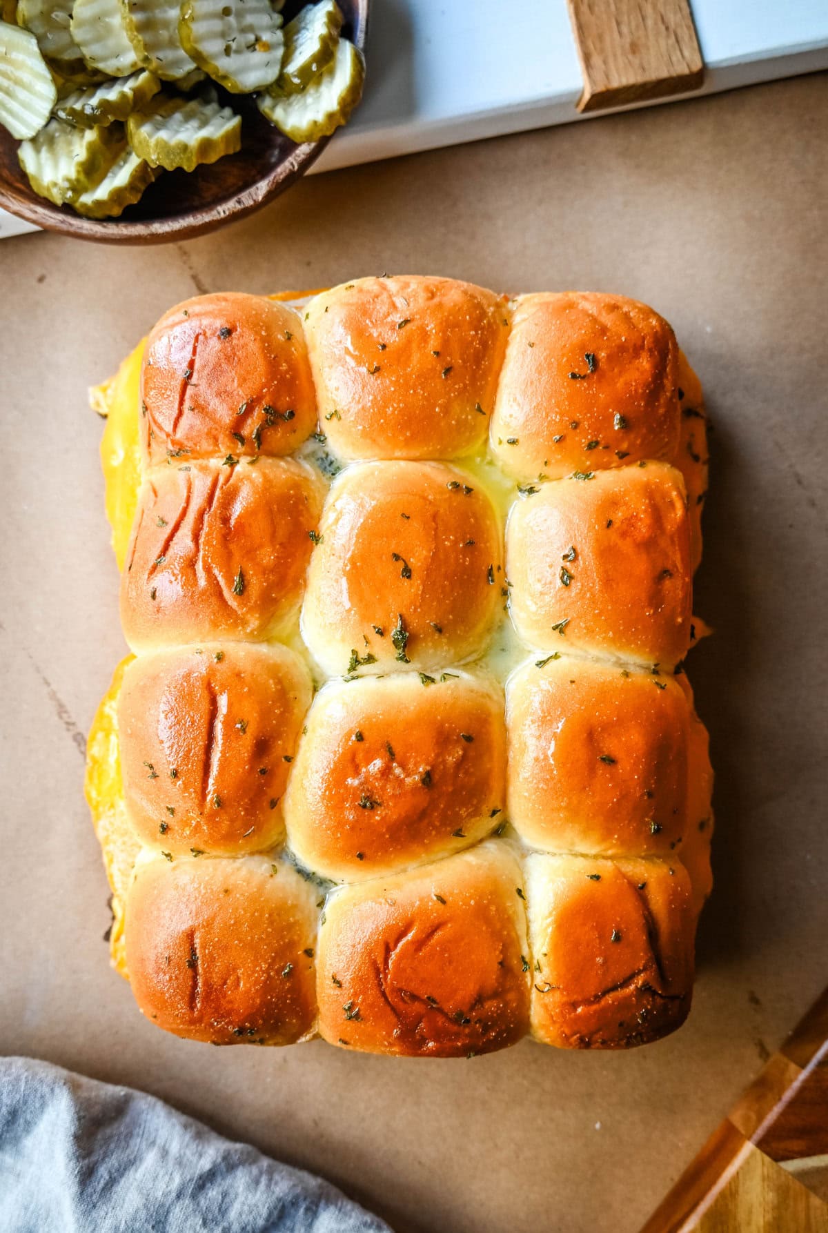 Garlic Herb Turkey and Cheddar Sliders. These Baked Turkey and Cheddar Sliders on Hawaiian Rolls with a sweet honey mustard spread and homemade garlic butter brushed on top are the perfect turkey slider recipe.  