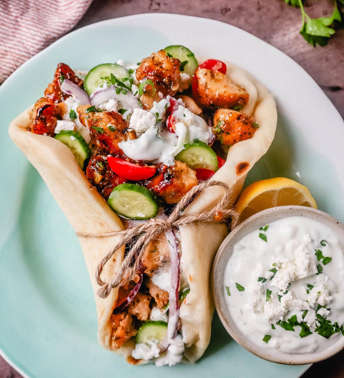 Greek Chicken Gyros with homemade tzatziki sauce. If you’re craving the vibrant flavors of the Mediterranean, chicken gyros with tzatziki sauce are the perfect choice. Tender, seasoned chicken, tangy tzatziki sauce, fresh greek salad, and soft, pillowy pita bread pair perfectly together. This is such a popular dinner recipe!