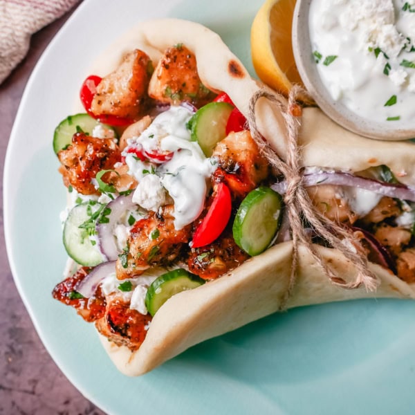 Greek Chicken Gyros with homemade tzatziki sauce. If you’re craving the vibrant flavors of the Mediterranean, chicken gyros with tzatziki sauce are the perfect choice. Tender, seasoned chicken, tangy tzatziki sauce, fresh greek salad, and soft, pillowy pita bread pair perfectly together. This is such a popular dinner recipe!