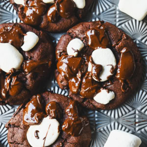 These Hot Cocoa Cookies feature a homemade chocolate cookie base, a gooey marshmallow topping, and a drizzle of melted chocolate for the perfect finishing touch. If you love peppermint, add crushed candy canes and a hint of peppermint extract for Peppermint Hot Cocoa Cookies.