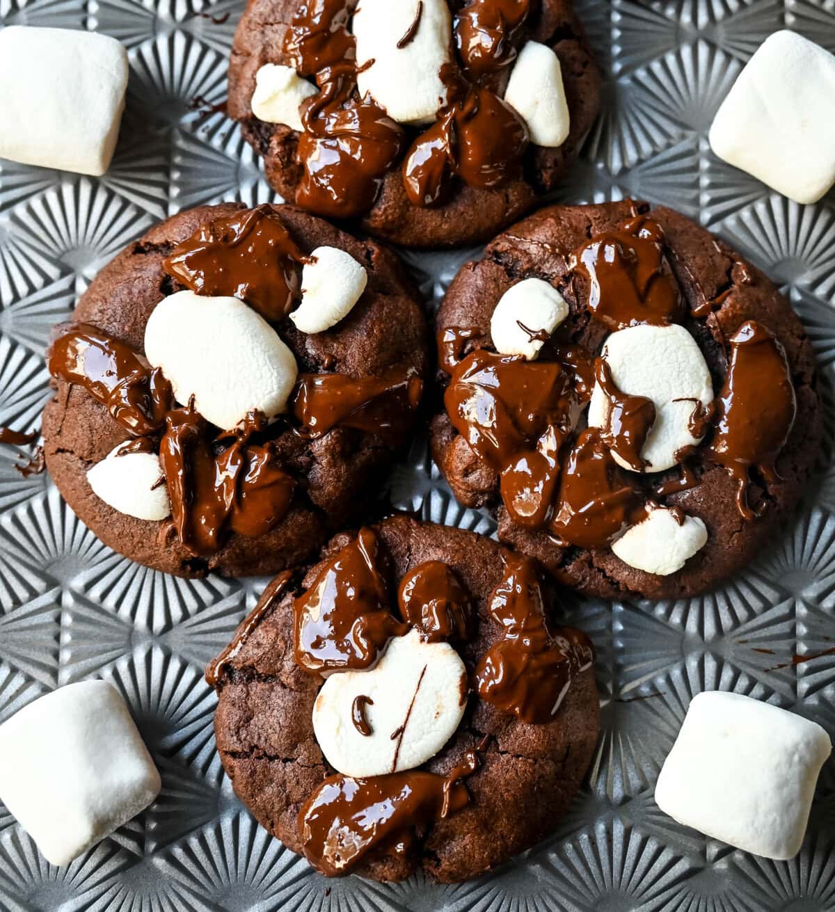 These Hot Cocoa Cookies feature a homemade chocolate cookie base, a gooey marshmallow topping, and a drizzle of melted chocolate for the perfect finishing touch. If you love peppermint, add crushed candy canes and a hint of peppermint extract for Peppermint Hot Cocoa Cookies.